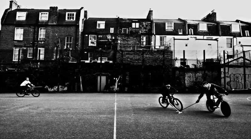 photo of people on bike black and white img